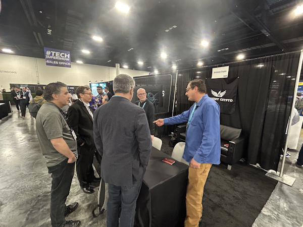 Visitors gathering at the Black Box Crypto™ trade-show booth